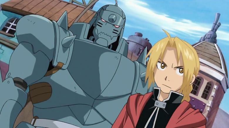 Alphonse and Edward standing together in a village in "Fullmetal Alchemist: Brotherhood" (2009-2010)