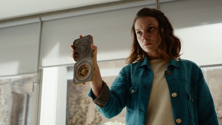 Lyra holding up the alethiometer in "His Dark Materials" (2019-2022)