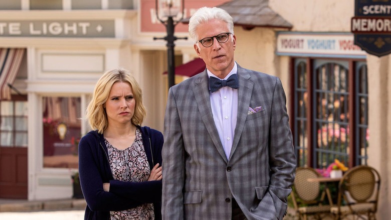 Eleanor and Michael watching someone in "The Good Place" (2016-2020)