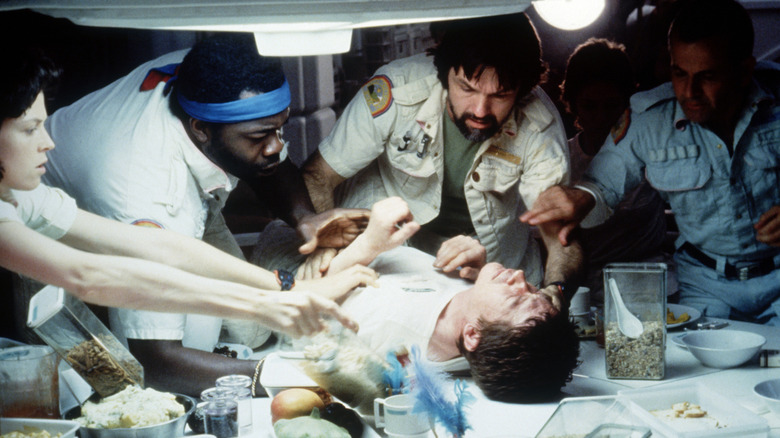 The Nostromo crew tries to save Kane in "Alien" (1979)