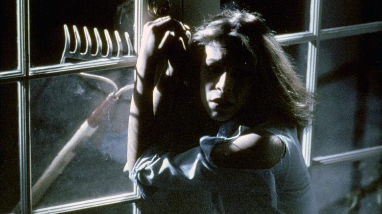 Laurie Strode tries to hide in "Halloween" (1978)