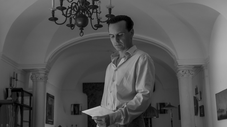 Tom Ripley looking down at a sealed letter in Ripley (2024)