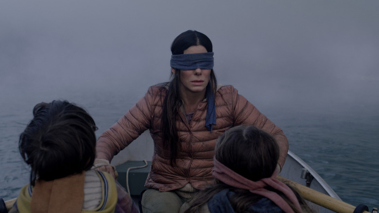 Malorie rowing her children to safety in "Bird Box"