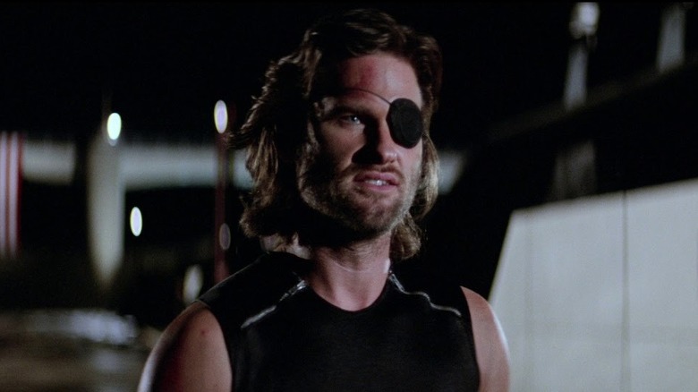 Snake Plissken in front of a USA flag in "Escape from New York"