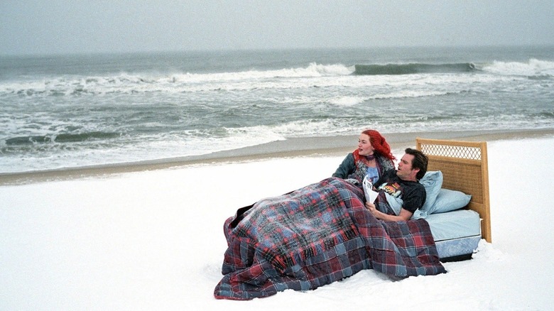 Joel and Clementine in bed on the beach in "Eternal Sunshine of the Spotless Mind"