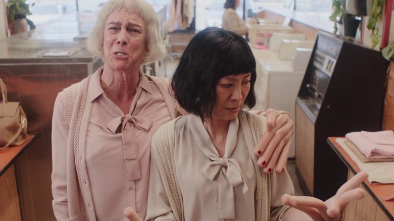 Evelyn looking at her and Deirdre's hotdog fingers in "Everything Everywhere All at Once"