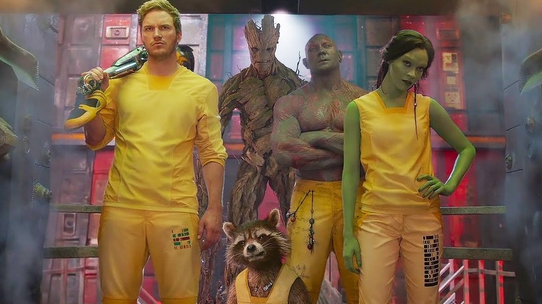 Peter Quill, Groot, Rocket Raccoon, Drax, and Gamora preparing to break out of prison