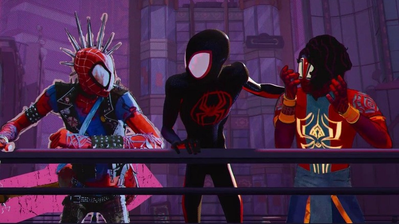 Spider-Punk/Hobie Brown, Miles Morales, and Pavitr Prabhakar leaning against a railing in heated discussion