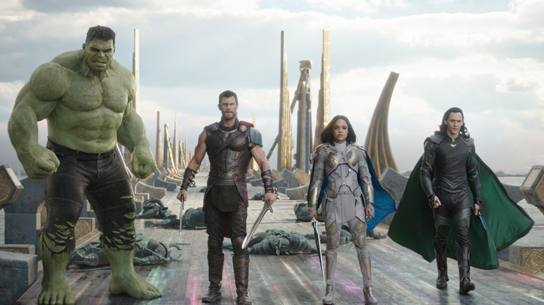 The Hulk, Thor, Valkyrie, and Loki standing their ground on Asgard's rainbow bridge