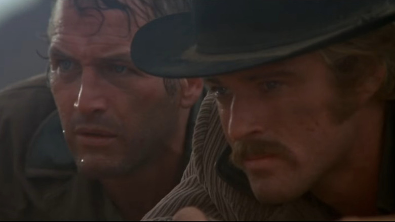 Butch Cassidy and the Sundance Kid looking off into the distance in Butch Cassidy and the Sundance Kid