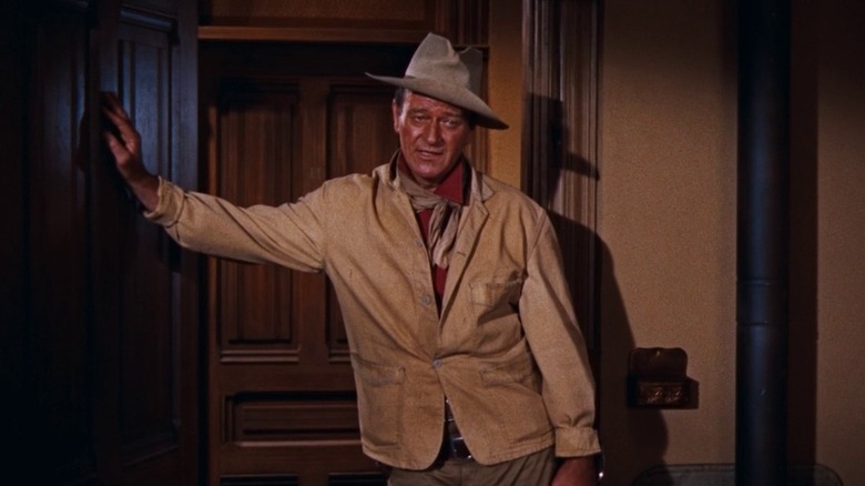 Sheriff John T. Chance leaning against a door in Rio Bravo