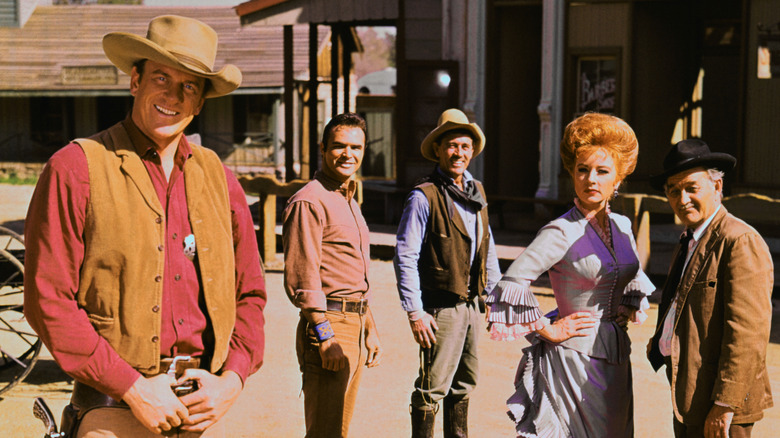 Marshal Matt Dillon, Quint Asper, Festus Hagan, Miss Kitty, and Doc Adams in Dodge City on Gunsmoke (1955-1975)