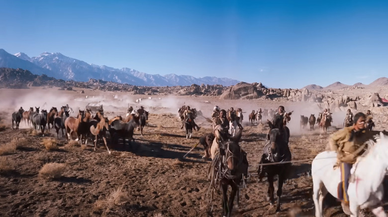 Men on horseback 1883 wagon train attack