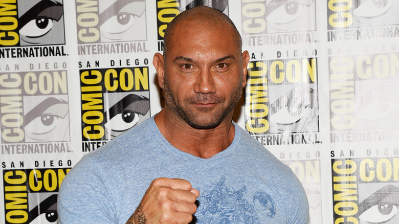 Dave Bautista holding up his fist at San Diego Comic Con