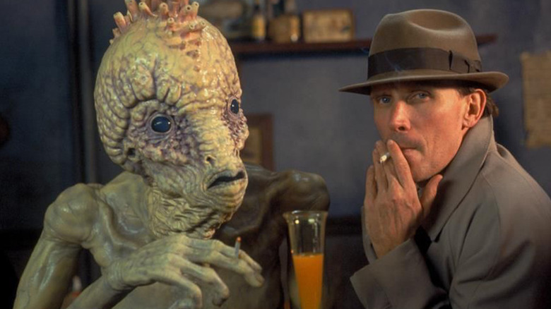 Bill at bar with giant insect in "Naked Lunch" (1991)