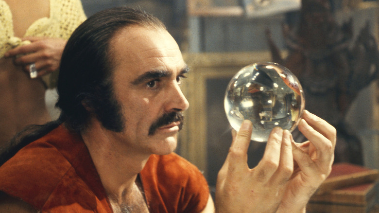 Zed looks at a crystal orb in 'Zardoz' (1974)
