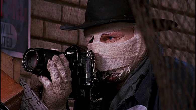 Dr. Peyton Westlake/Darkman taking photos in "Darkman"