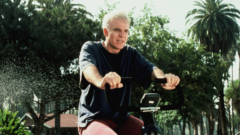 Harris K. Telemacher riding exercise bike outside