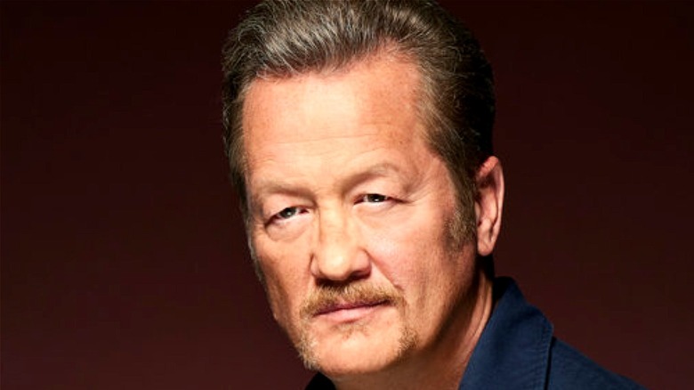 Christian Stolte against dark background