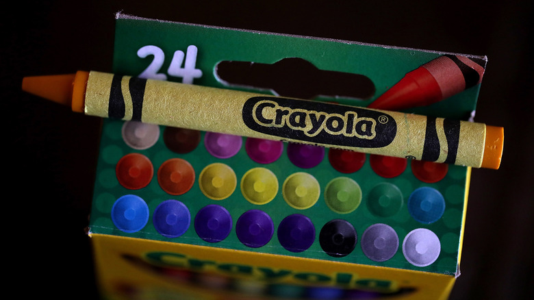 Yellow crayon out of Crayola package