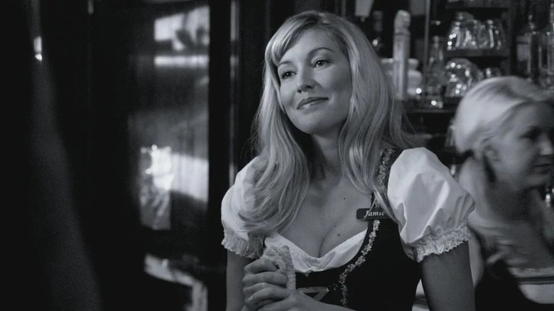 Jamie smiles behind the bar in Supernatural