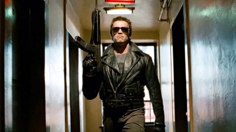 The T-800 holding gun in hallway