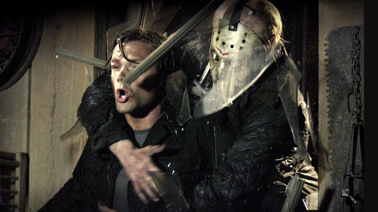Jason grabs a victim in "Friday the 13th" (2009)