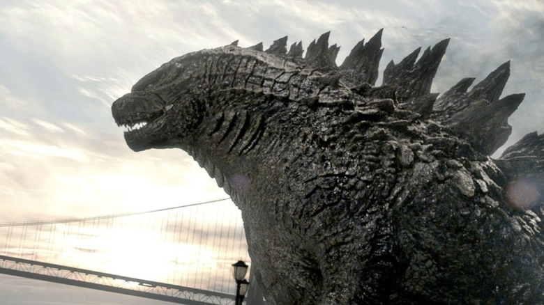 Godzilla walking toward waterfront in "Godzilla" (2014)