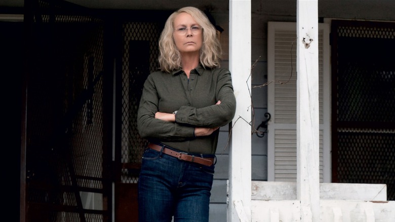 Laurie Strode standing with crossed arms on porch in Halloween (2018)