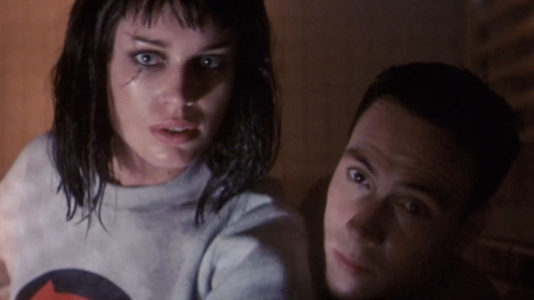 Rebecca Romijn-Stamos and Chris Klein in Rollerball