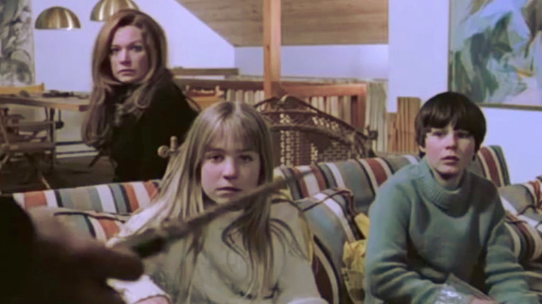 The Bensons looking scared at a knife