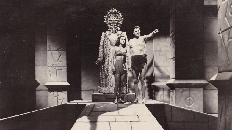 Tarzan pointing beside Jane