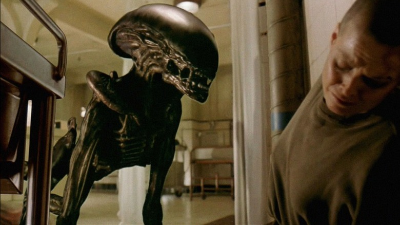 Xenomorph comes up to Ripley in prison