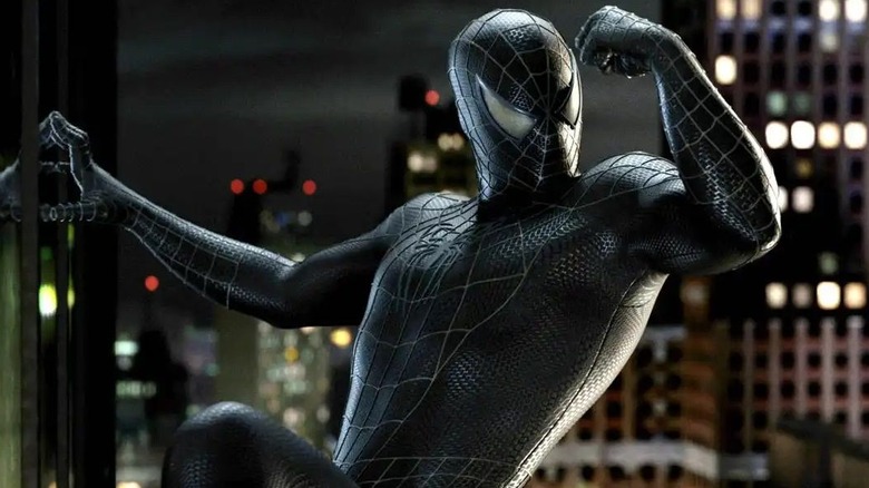 Spider-man admires black costume