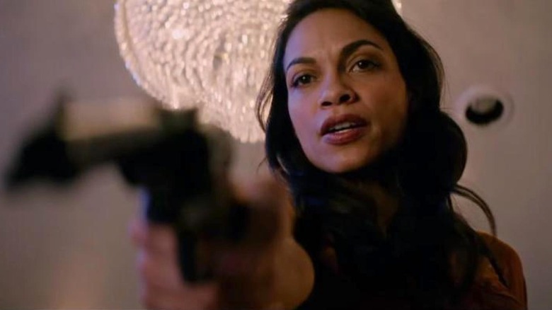 Nevada points a gun in "Zombieland: Double Tap" (2019)