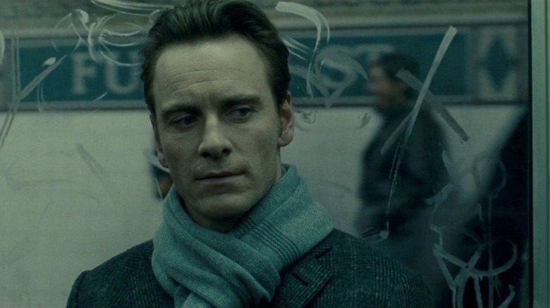 Brandon sits on a subway train