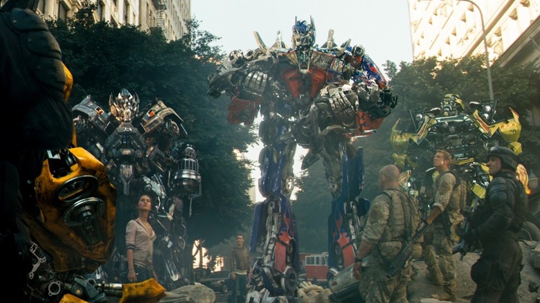 Optimus Prime holding the body of Jazz in Transformers (2007)