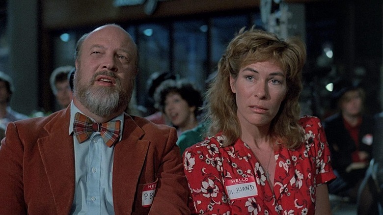 Paul and Mary gossip in the audience in "Chopping Mall" (1986)