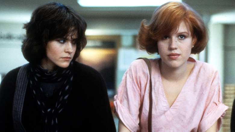 Claire and Allison sitting on table together in The Breakfast Club