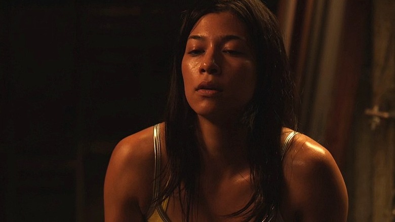 Tara sitting down looking dejected in "Vile" (2011)