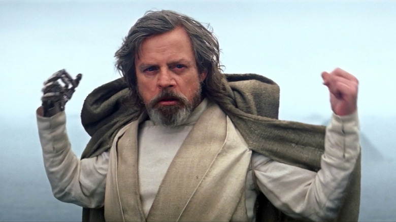Luke removes his hood