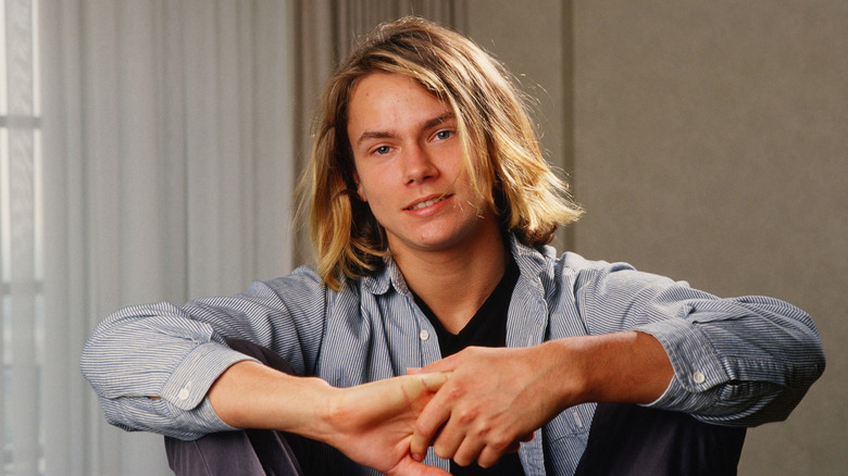 River Phoenix poses for a photo