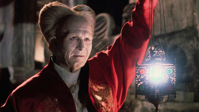 Dracula looks pleased while holding a lantern in "Bram Stoker's Dracula" (1992)