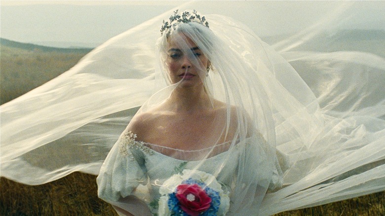 Cathy Earnshaw miserably wears a wedding gown in 