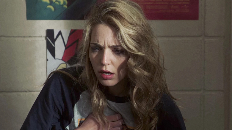 Tree clutches her heart in "Happy Death Day" (2017)
