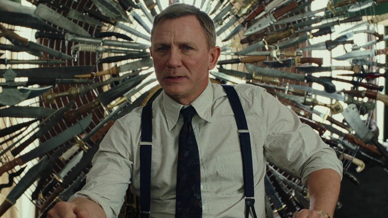 Benoit Blanc sits on Harlan's chair of knives in "Knives Out" (2019)