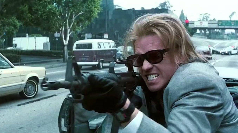Chris fires a machine gun on the street in broad daylight in "Heat" (1995)
