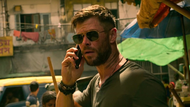 Tyler on phone in "Extraction" (2020)