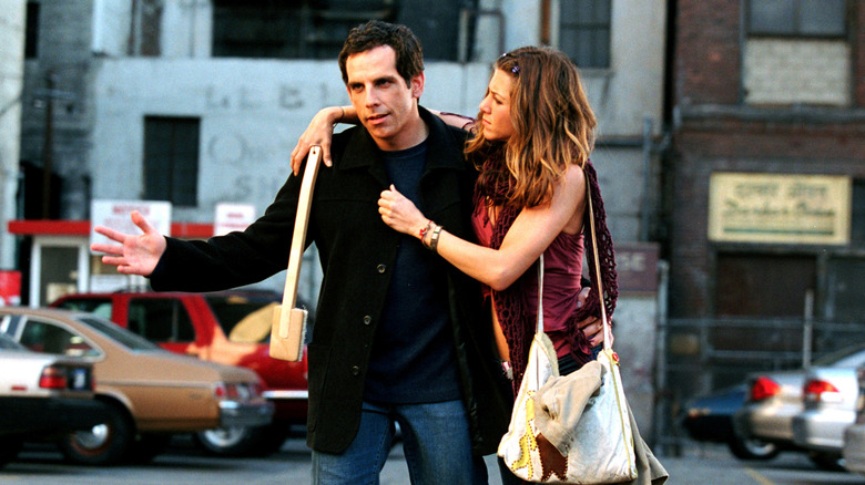 Reuben walking with Polly hanging off him in Along Came Polly