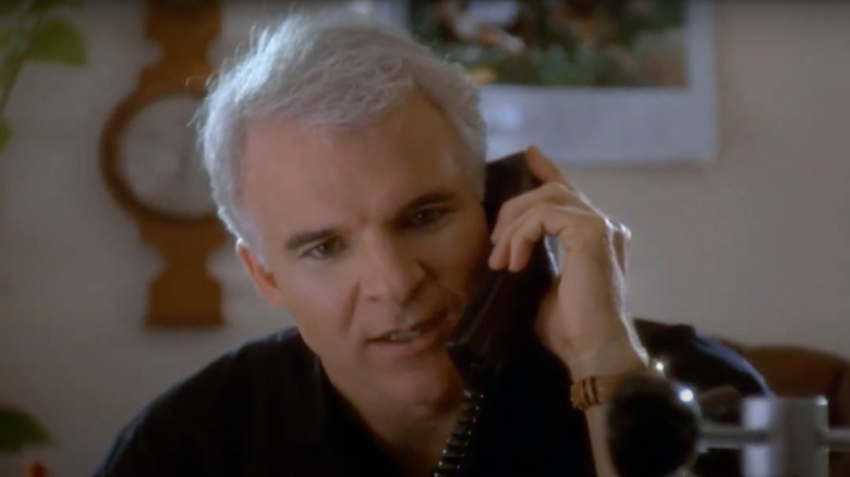 Steve Martin speaks on the phone.